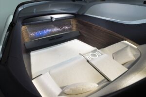 ...the Vision 100 is self driving and the inside of the vehicle just consists of a giant television and a large sofa.